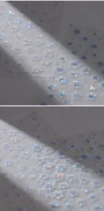 Close-up of 3D embossed floral nail stickers with laser iridescent finish and flowers