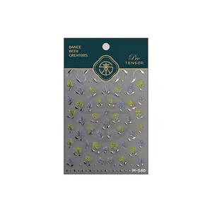 3D embossed floral nail stickers with gold outlines and blue roses on original card