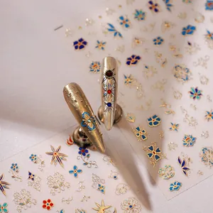 Golden 3D embossed nail art stickers with baroque floral and star patterns for women