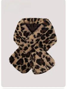Detail shot of leopard print faux fur scarf showing soft texture and cross design