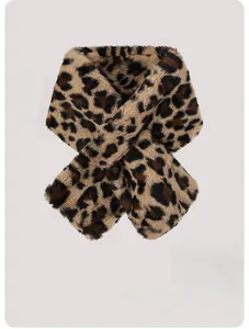 Detailed close-up of fluffy leopard print faux fur scarf with soft plush texture