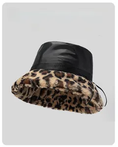 Detailed view of winter leopard faux fur lining and glossy crown of the warm bucket hat