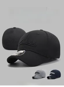 Detail view of breathable laser-cut holes and 3D embroidery on short brim baseball cap