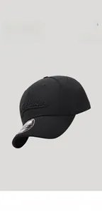 Close-up of black baseball cap featuring breathable laser-cut holes and 3D embroidery detail