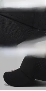 Detailed macro view of black baseball cap with laser perforated side vents and stitching