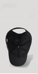 Detail showing the inner structure, breathable mesh, and reinforced seams of a black baseball cap