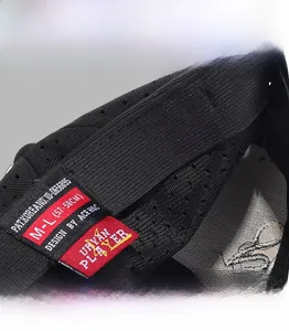 Detail view of black baseball cap interior featuring breathable mesh and size M-L labels