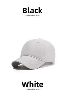 Close-up of white waterproof baseball cap featuring reinforced double stitching on the brim