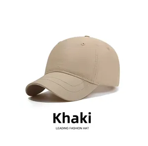 Detailed close-up of khaki waterproof baseball cap showing reinforced stitching and texture