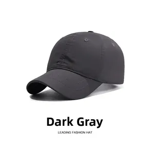 Close-up of a dark grey waterproof baseball cap with breathable vents and stitching
