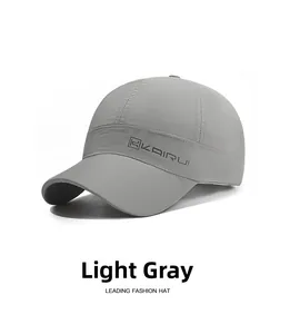 Detail view of light grey quick-dry baseball cap featuring breathable eyelets and side logo