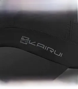 Detail view of quick-dry black baseball cap featuring premium side embroidery and logo