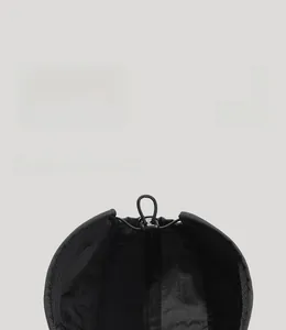 Detail of breathable inner lining with elastic drawcord and plastic buckle on black cap