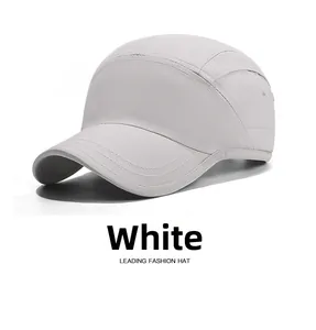 Close-up of white waterproof five-panel hat with reinforced stitching on the short brim