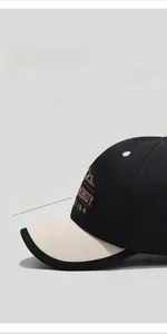 Detail view of two-tone baseball cap with a 5cm short brim and vintage embroidery