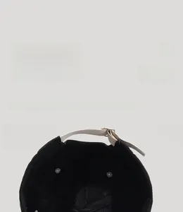 Detail view of the breathable black mesh lining and adjustable metal buckle on baseball cap