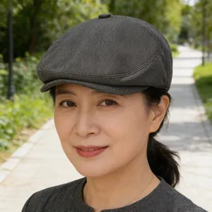 Elegant dark grey newsboy flat cap for middle-aged women in old money style outdoors.