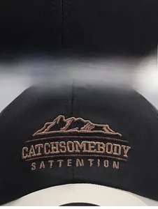 Close-up of high-density embroidery and stitching on the cotton baseball cap brim