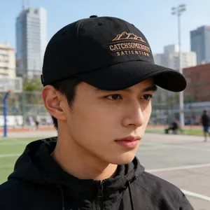 Short brim baseball cap with letter embroidery and mountain design on black cotton crown