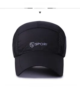 Front view of black quick-dry sport cap with mesh panels and gray printed logo