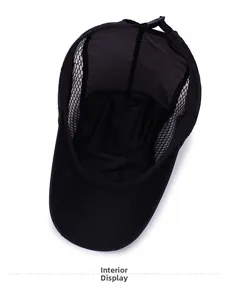 Detail view of the breathable mesh interior and adjustable strap of the black baseball cap