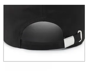 Detail shot of the black cotton baseball cap showing adjustable strap and silver metal buckle