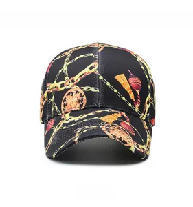 Front view of black cotton baseball cap with baroque gold chain and tassel patterns