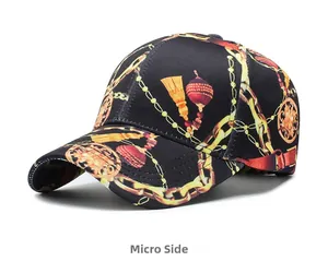 Micro side view of black baseball cap with golden baroque chain and tassel prints