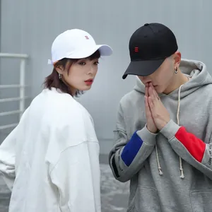 Matching black and white cotton baseball caps with red stripe embroidery for couples