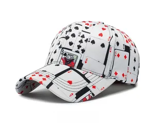 Close-up of playing cards print pattern on a white baseball cap from a side angle