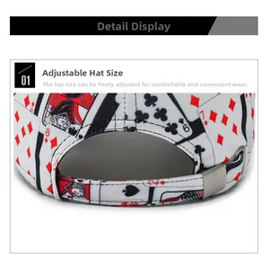 Close-up of adjustable metal buckle on white baseball cap with playing cards print