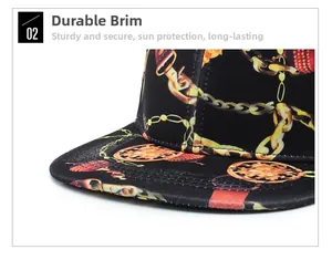 Detail of sturdy flat brim baseball cap featuring vintage gold chain and coin patterns