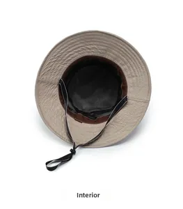 Detail of sun hat interior showing breathable black mesh lining and adjustable chin cord