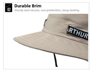 Detail of beige bucket hat featuring robust brim stitching and Arthur letter webbing