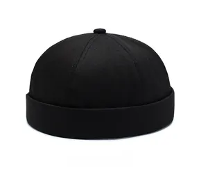 Micro-side view of black cotton twill brimless docker cap with classic rolled edge