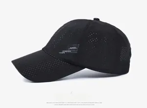 Side view of black breathable baseball cap showing mesh ventilation and letter design