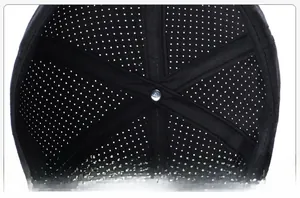 Close-up of black baseball cap interior showing breathable mesh and reinforced stitching
