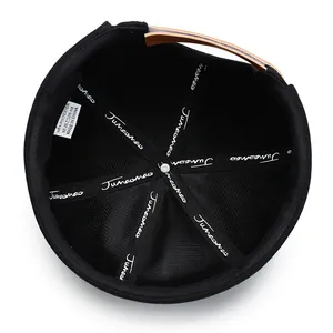 Black brimless docker cap interior with 100% polyester fabric and brown leather strap