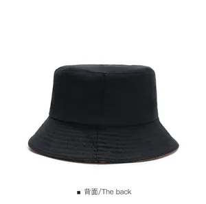 Rear view of minimalist black cotton sun hat showing clean structure and stitching details