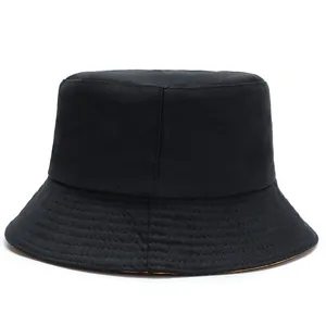 Classic black cotton twill bucket hat with orange interior lining and reinforced brim