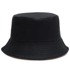Minimalist double-sided sun bucket hat in black and yellow with twill canvas texture