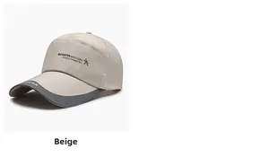 Detail shot of beige baseball cap with Modern British logo and contrast brim binding