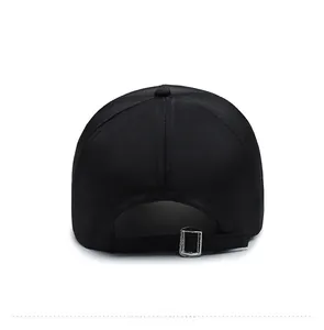 Detail view of the black baseball cap rear showing the adjustable silver metal buckle