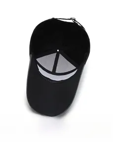 Macro view showing the interior lining and metal buckle of the black baseball cap