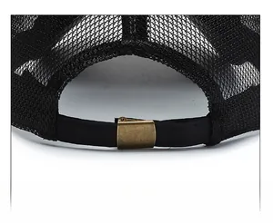 Detail of black mesh baseball cap showing adjustable back strap and bronze metal buckle