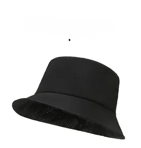 Close-up of black breathable bucket hat showing laser-cut ventilation holes for cooling