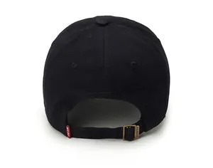 Detail of adjustable metal buckle and red brand tag on a black cotton baseball cap