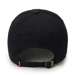 Rear view of black cotton baseball cap showing adjustable strap and bronze buckle