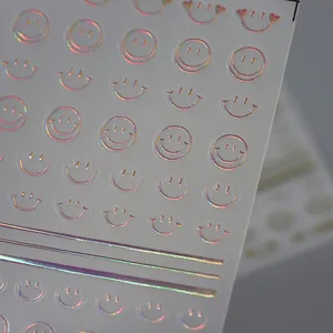 Holographic laser smiling face nail art stickers with metallic finish and gold foil