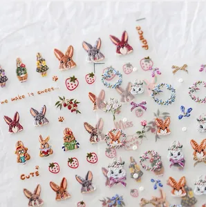 Nahaufnahme von 5D-Präge-Nagelstickern mit süßen Hasen und floralen Stickmustern